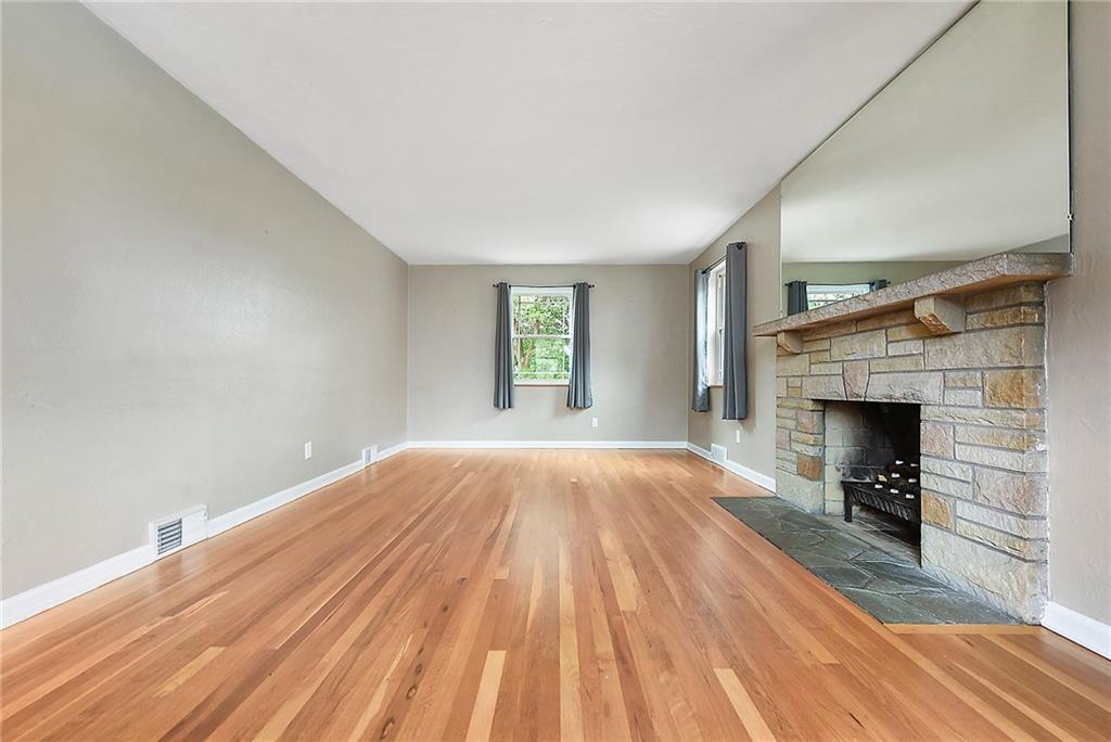 1161 Prospect Road Pittsburgh, PA 15227 - Photo 12 of 39 a view of empty room with wooden floor and fireplace