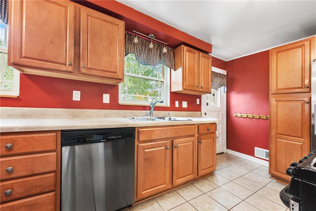 1161 Prospect Road Pittsburgh, PA 15227 - Photo 17 of 39 a kitchen with stainless steel appliances granite countertop a refrigerator and a sink