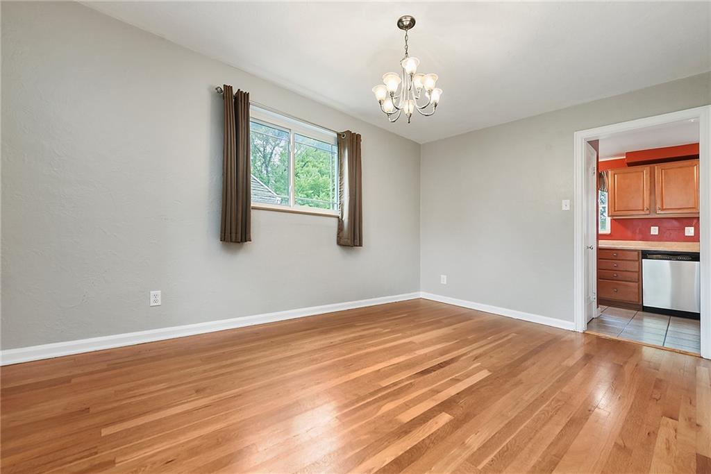 1161 Prospect Road Pittsburgh, PA 15227 - Photo 20 of 39 a view of an empty room with a window and wooden floor