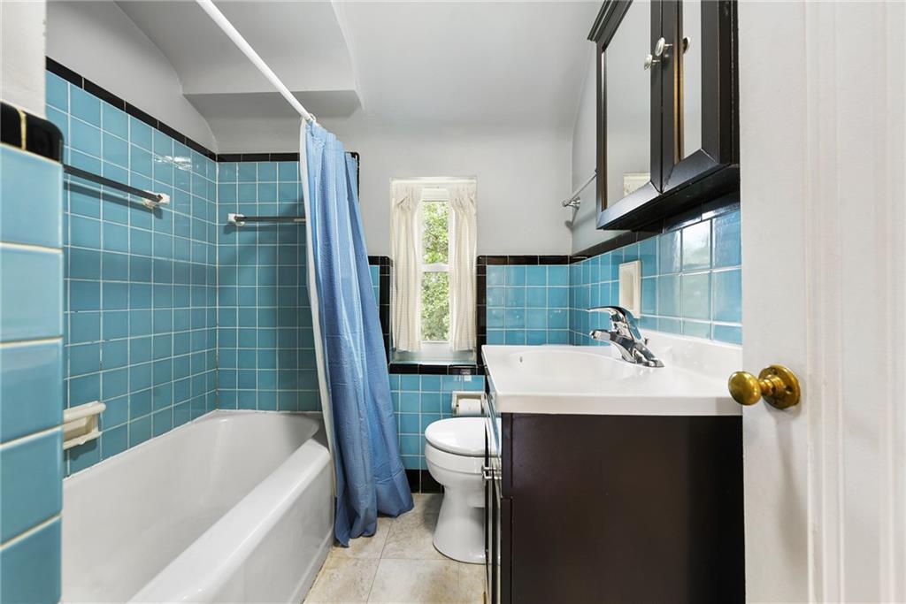 1161 Prospect Road Pittsburgh, PA 15227 - Photo 25 of 39 a bathroom with a sink a toilet and shower