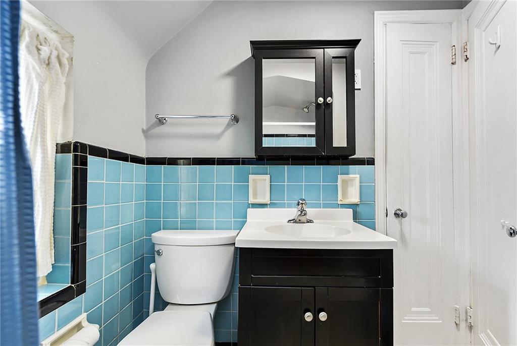 1161 Prospect Road Pittsburgh, PA 15227 - Photo 26 of 39 a bathroom with a sink toilet and mirror