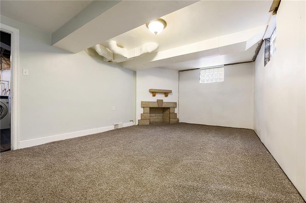 1161 Prospect Road Pittsburgh, PA 15227 - Photo 31 of 39 an empty room with a ceiling fan and window