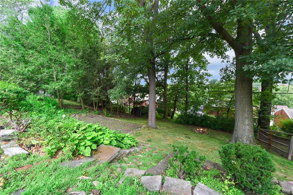 1161 Prospect Road Pittsburgh, PA 15227 - Photo 34 of 39 a backyard of a house with lots of green space and garden view