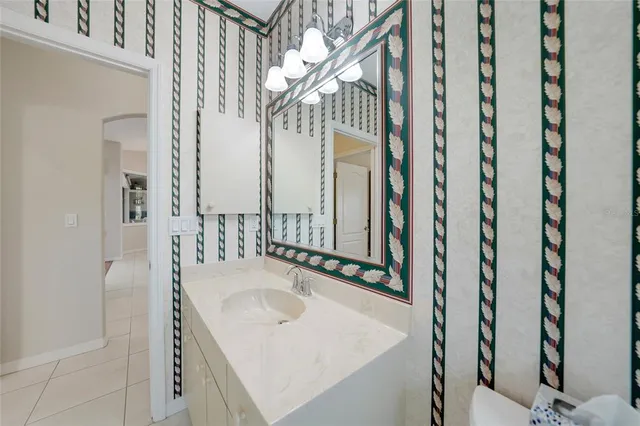 a view of a patio with table and chairs under an umbrella
