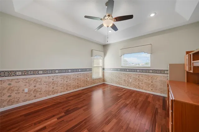 a view of a patio with table and chairs under an umbrella
