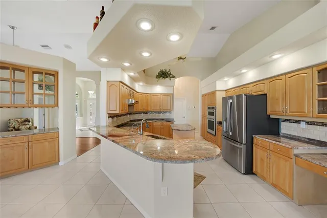 a view of a kitchen with a sink and a stove top oven