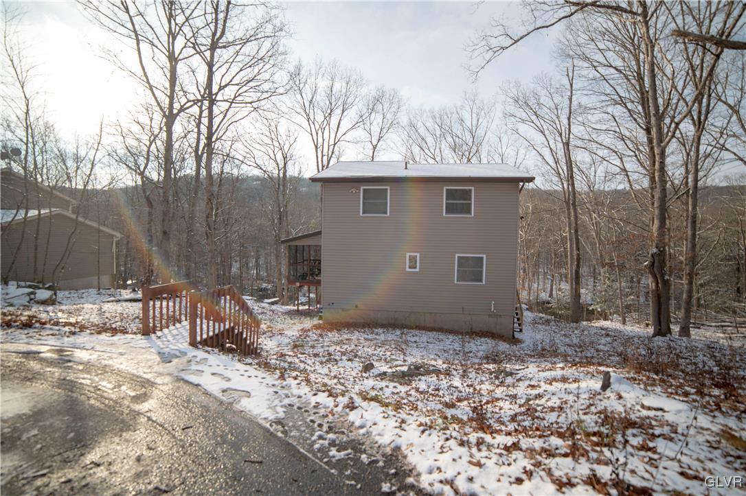 6360 Decker Road Bushkill, PA 18324 - Photo 1 of 35 a backyard of a house with table and chairs