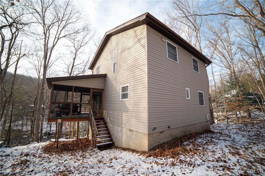 6360 Decker Road Bushkill, PA 18324 - Photo 4 of 35 a view of a house with a yard