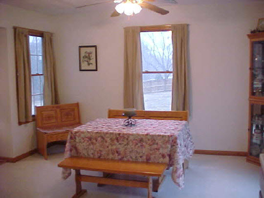 8188 Mcmichael Road Caledonia, IL 61011 - Photo 5 of 6 a bedroom with a bed and a window