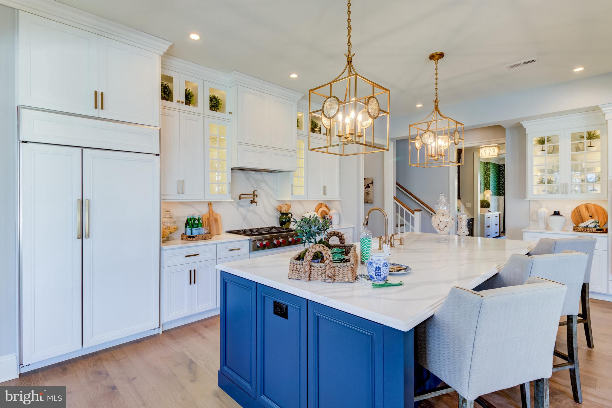 319 Iven Avenue Wayne, PA 19087 - Photo 15 of 44 a kitchen with refrigerator cabinets dining table and chairs