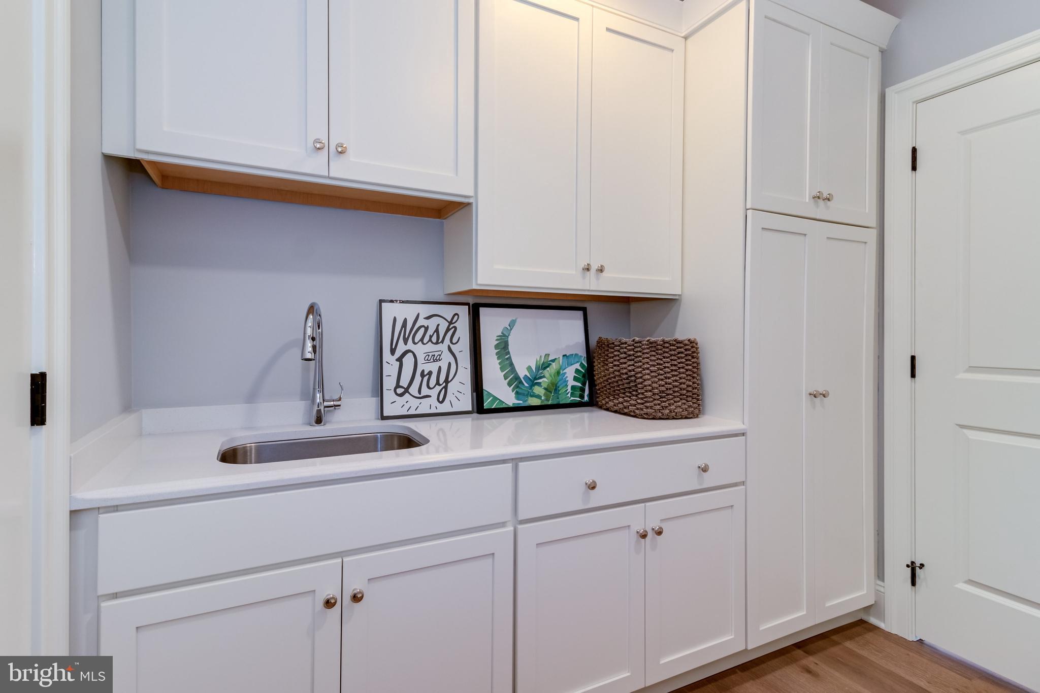 319 Iven Avenue Wayne, PA 19087 - Photo 29 of 44 a kitchen with white cabinets and a sink