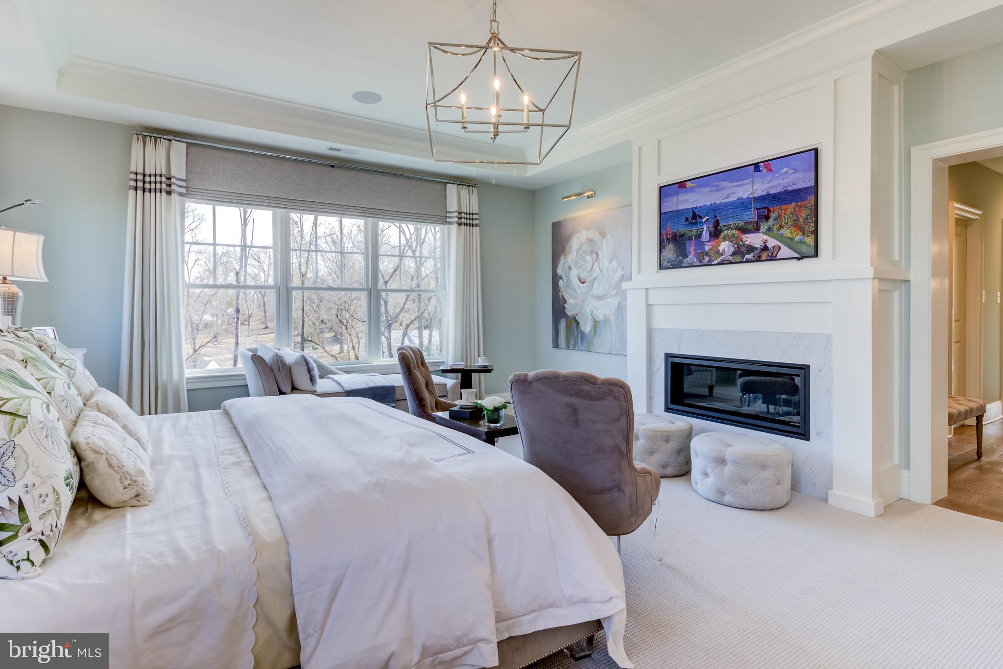 319 Iven Avenue Wayne, PA 19087 - Photo 35 of 44 a bedroom with bed and a fireplace