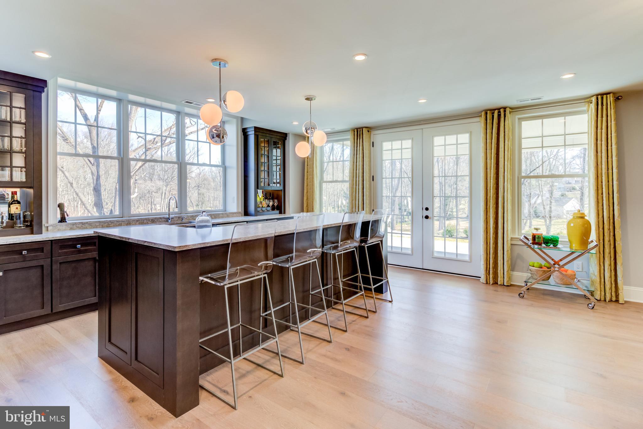 319 Iven Avenue Wayne, PA 19087 - Photo 43 of 44 a dining room with wooden floor and large windows
