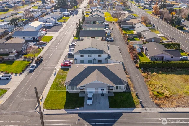 an aerial view of residential houses with swimming pool