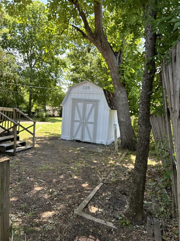 6318 Belgrade Avenue Dallas, TX 75227 - Photo 23 of 23 a house covered with tall trees