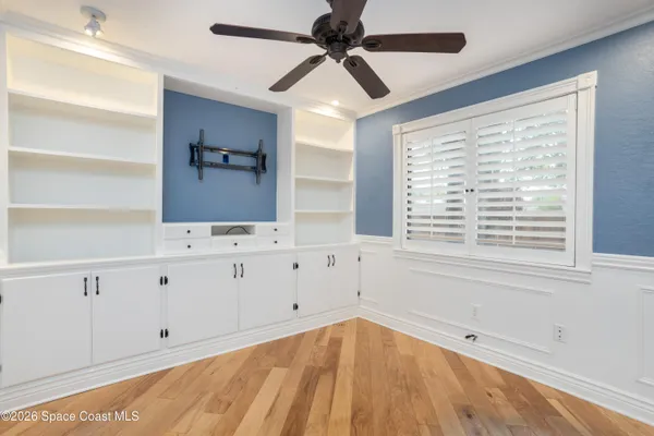 a bathroom with a sink a toilet a mirror and shower