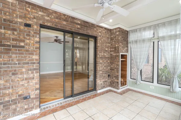 a view of an entryway with a floor to ceiling window