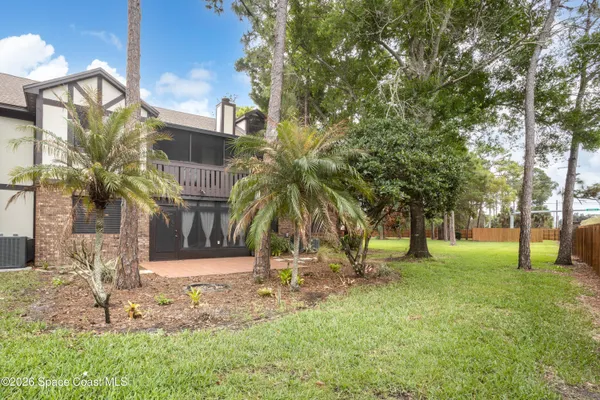a backyard of a house with lots of green space