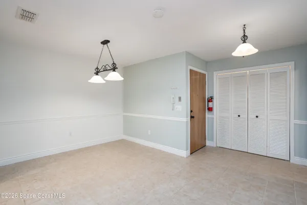 a view of a room with a ceiling fan