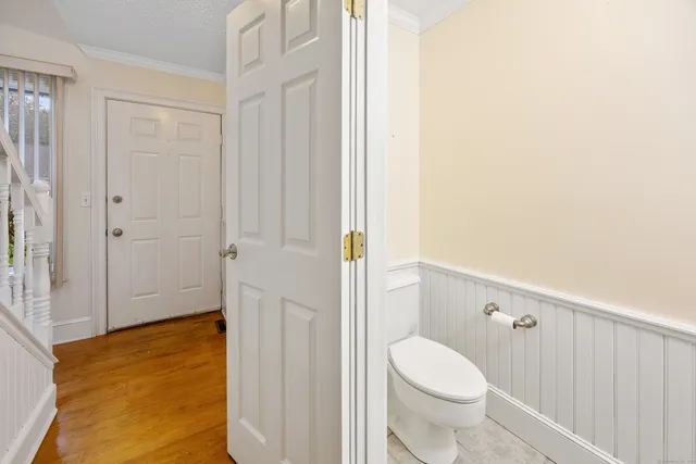 a bathroom with a toilet and a shower