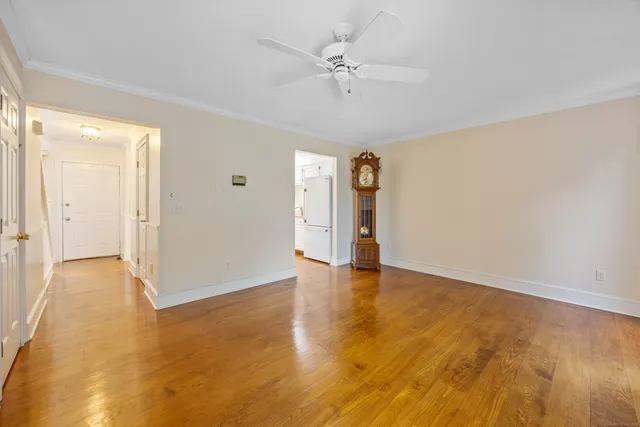 a view of an empty room and a window