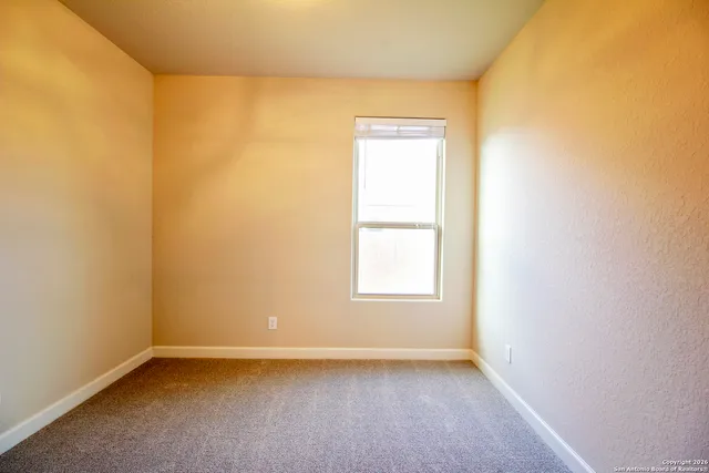 a kitchen with granite countertop cabinets stainless steel appliances a sink and a window