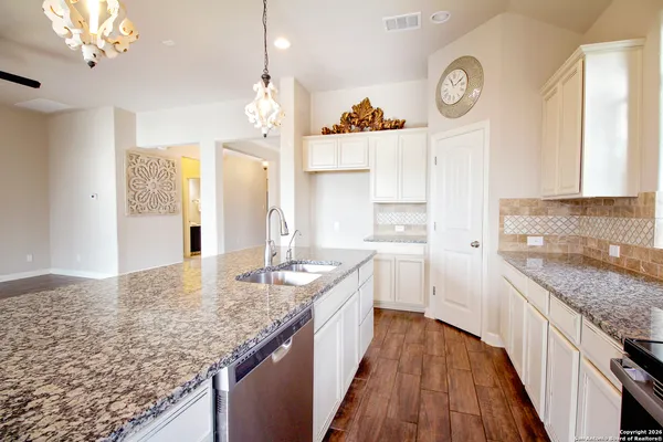 a bathroom with a bathtub and a sink