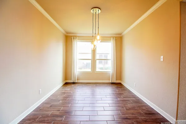 a open kitchen with stainless steel appliances granite countertop a sink a stove a kitchen island with wooden floor and cabinets