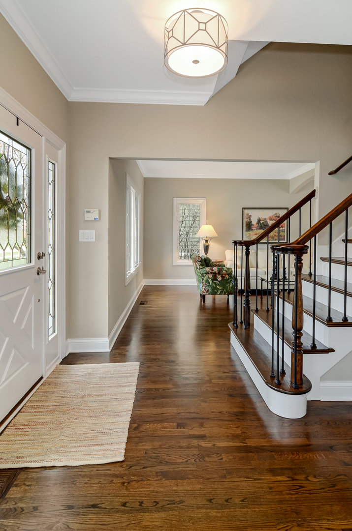307 North County Line Road Hinsdale, IL 60521 - Photo 3 of 31 a view of entryway and hall with wooden floor