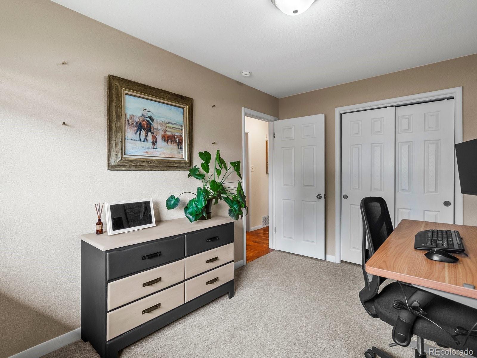 4963 North Harlan Street Wheat Ridge, CO 80033 - Photo 19 of 42 a room with furniture and a window