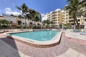 a view of a swimming pool with a yard