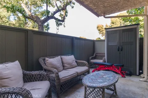 a outdoor living space with furniture and a potted plant
