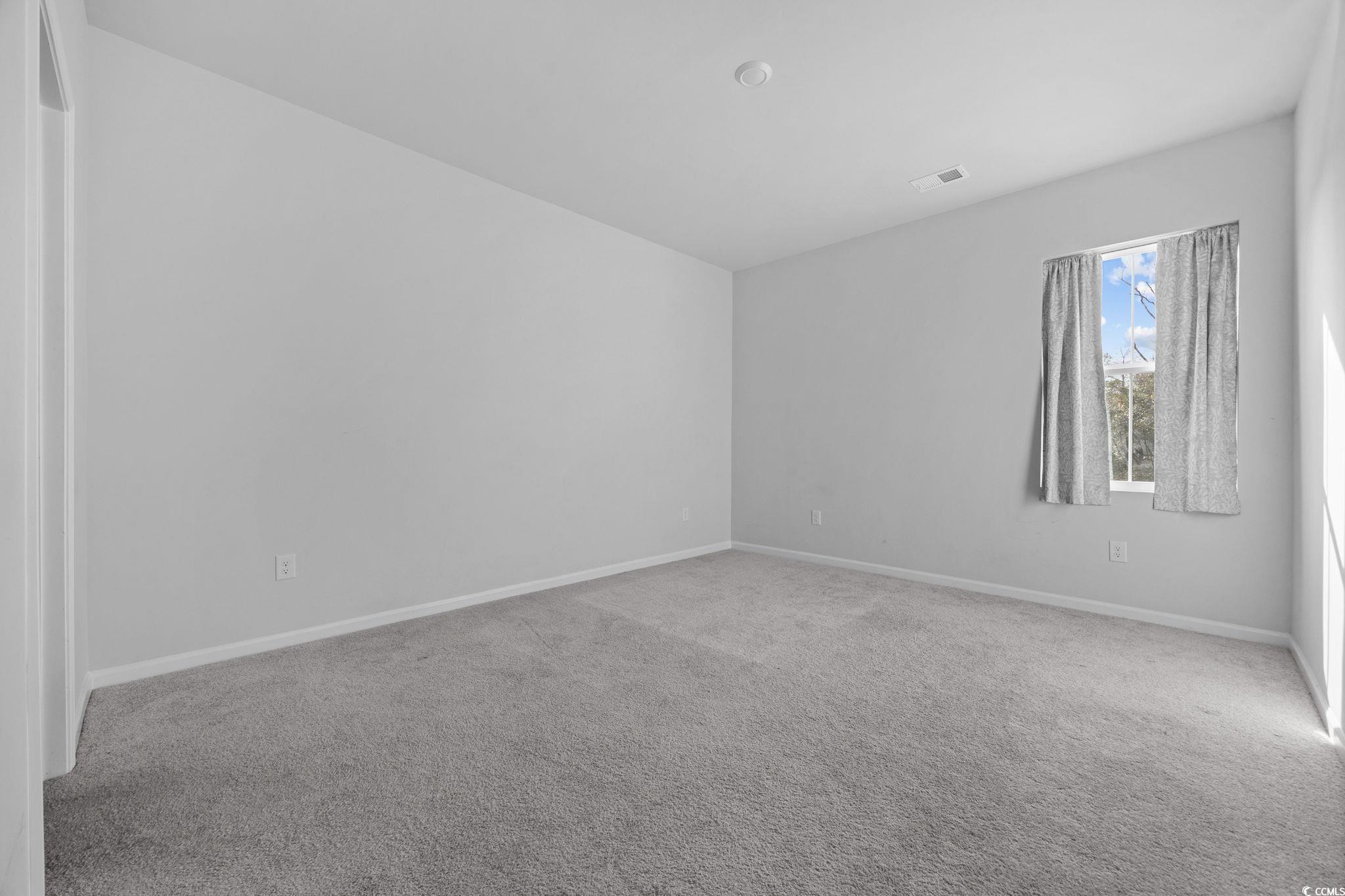 608 Sea Sparrow Street, Unit 608 Myrtle Beach, SC 29588 - Photo 14 of 37 Empty room with carpet and baseboards
