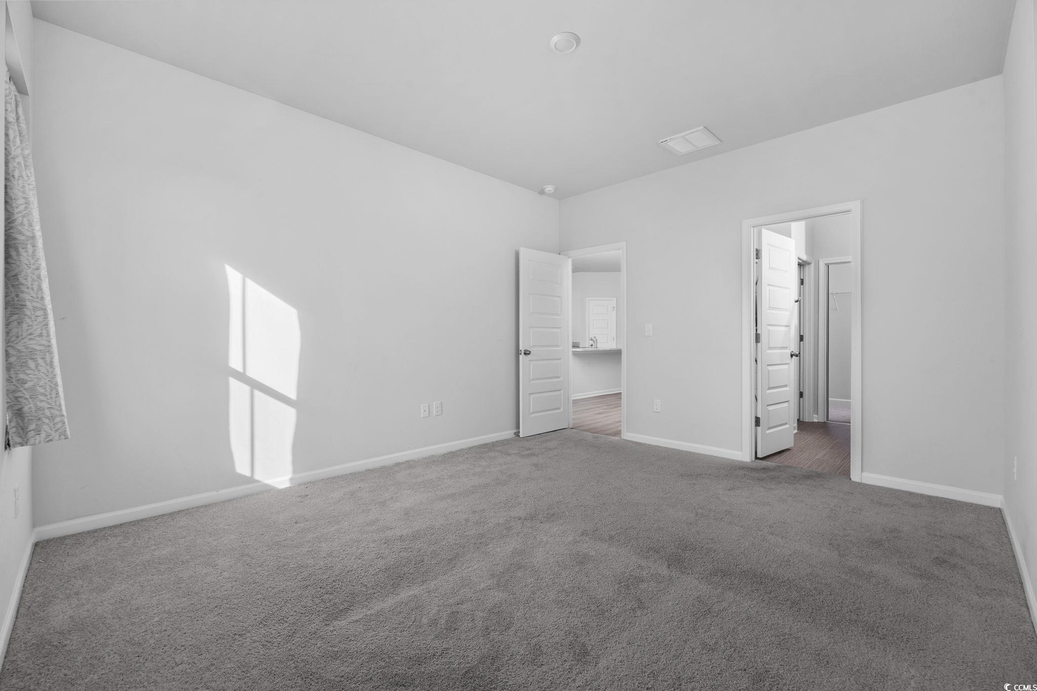 608 Sea Sparrow Street, Unit 608 Myrtle Beach, SC 29588 - Photo 15 of 37 Unfurnished bedroom with carpet floors and baseboards