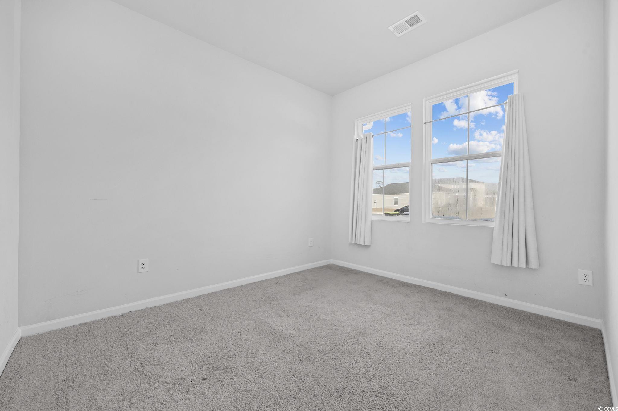608 Sea Sparrow Street, Unit 608 Myrtle Beach, SC 29588 - Photo 18 of 37 Carpeted spare room featuring baseboards