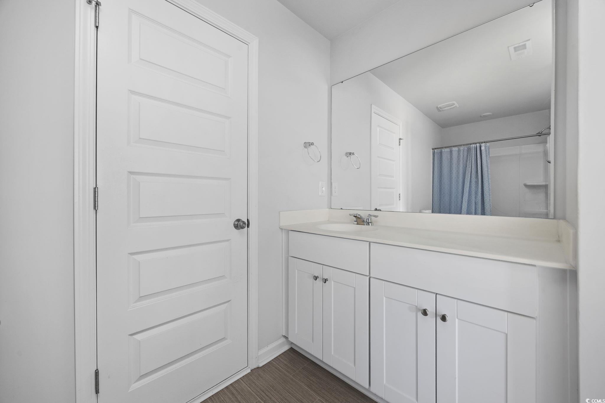 608 Sea Sparrow Street, Unit 608 Myrtle Beach, SC 29588 - Photo 23 of 37 Full bath with vanity and curtained shower