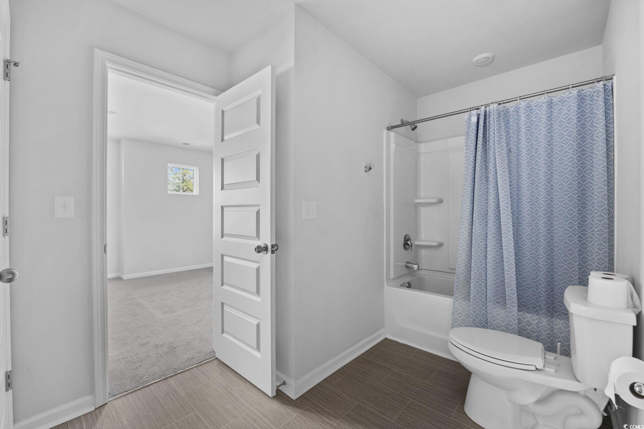 608 Sea Sparrow Street, Unit 608 Myrtle Beach, SC 29588 - Photo 24 of 37 Full bath featuring shower / tub combo and baseboards