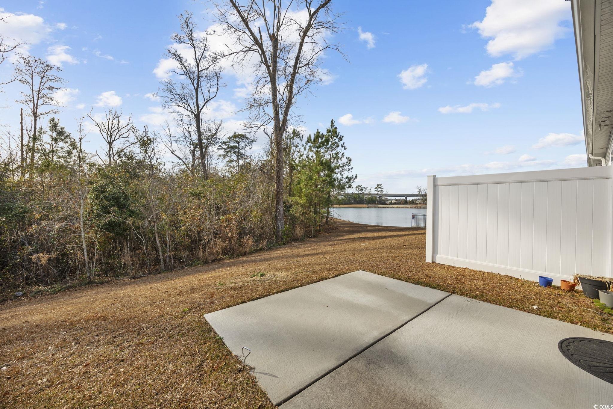 608 Sea Sparrow Street, Unit 608 Myrtle Beach, SC 29588 - Photo 25 of 37 View of yard featuring a patio and a water view