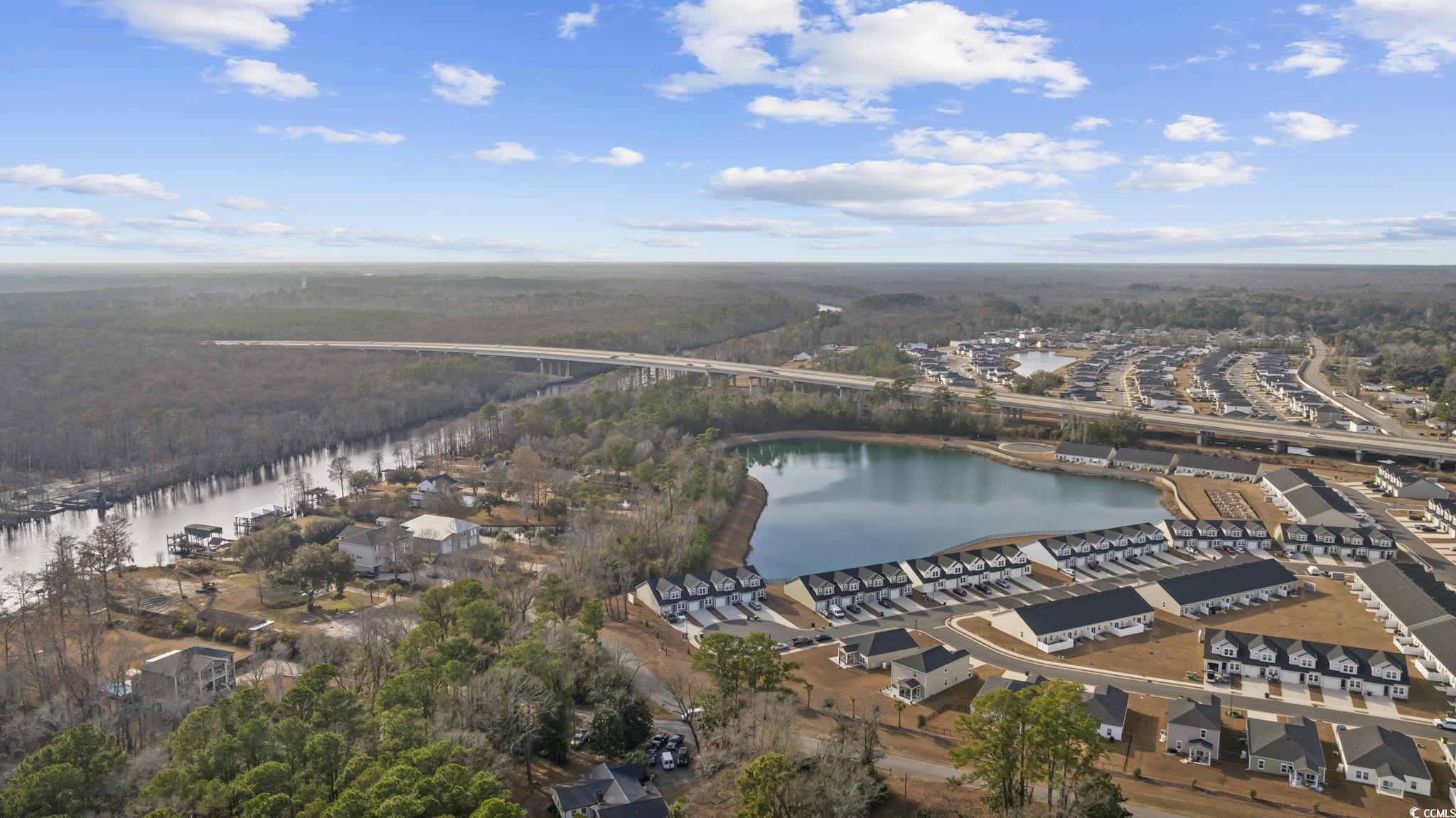 608 Sea Sparrow Street, Unit 608 Myrtle Beach, SC 29588 - Photo 30 of 37 Aerial view of property and surrounding area featuring a large body of water