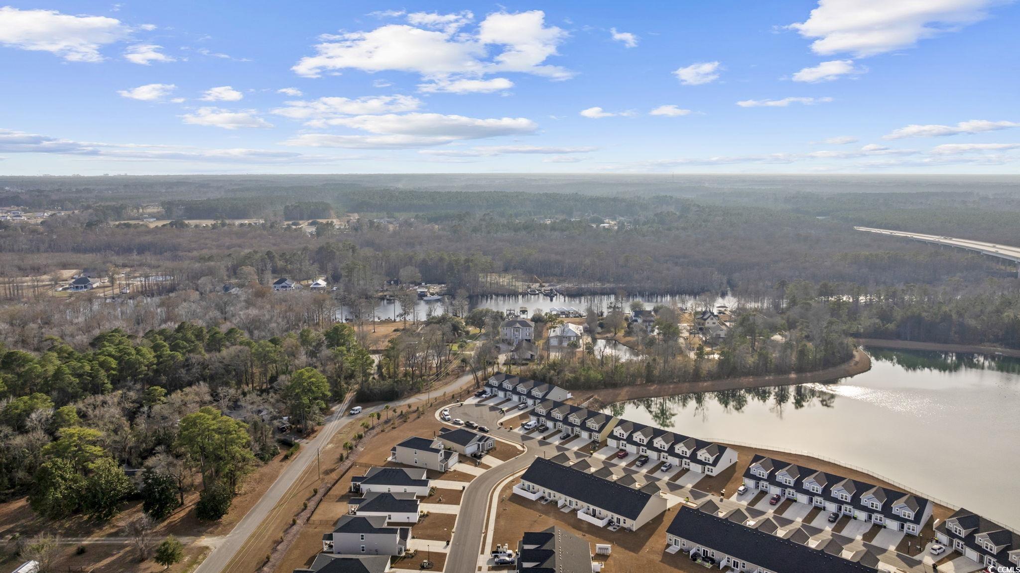 608 Sea Sparrow Street, Unit 608 Myrtle Beach, SC 29588 - Photo 32 of 37 Aerial view of property's location featuring a heavily wooded area and a nearby body of water