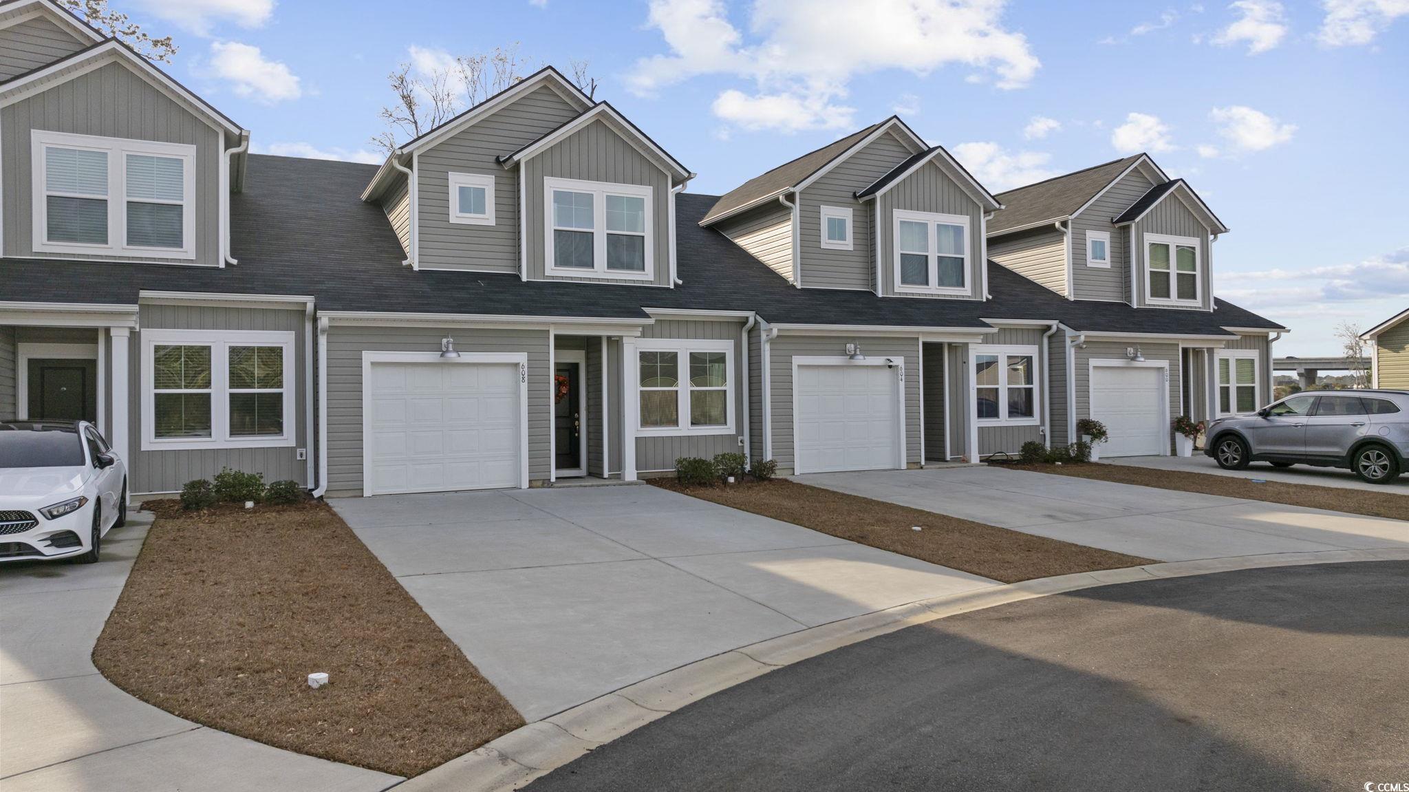 608 Sea Sparrow Street, Unit 608 Myrtle Beach, SC 29588 - Photo 34 of 37 Traditional-style home featuring driveway, a garage, and a shingled roof