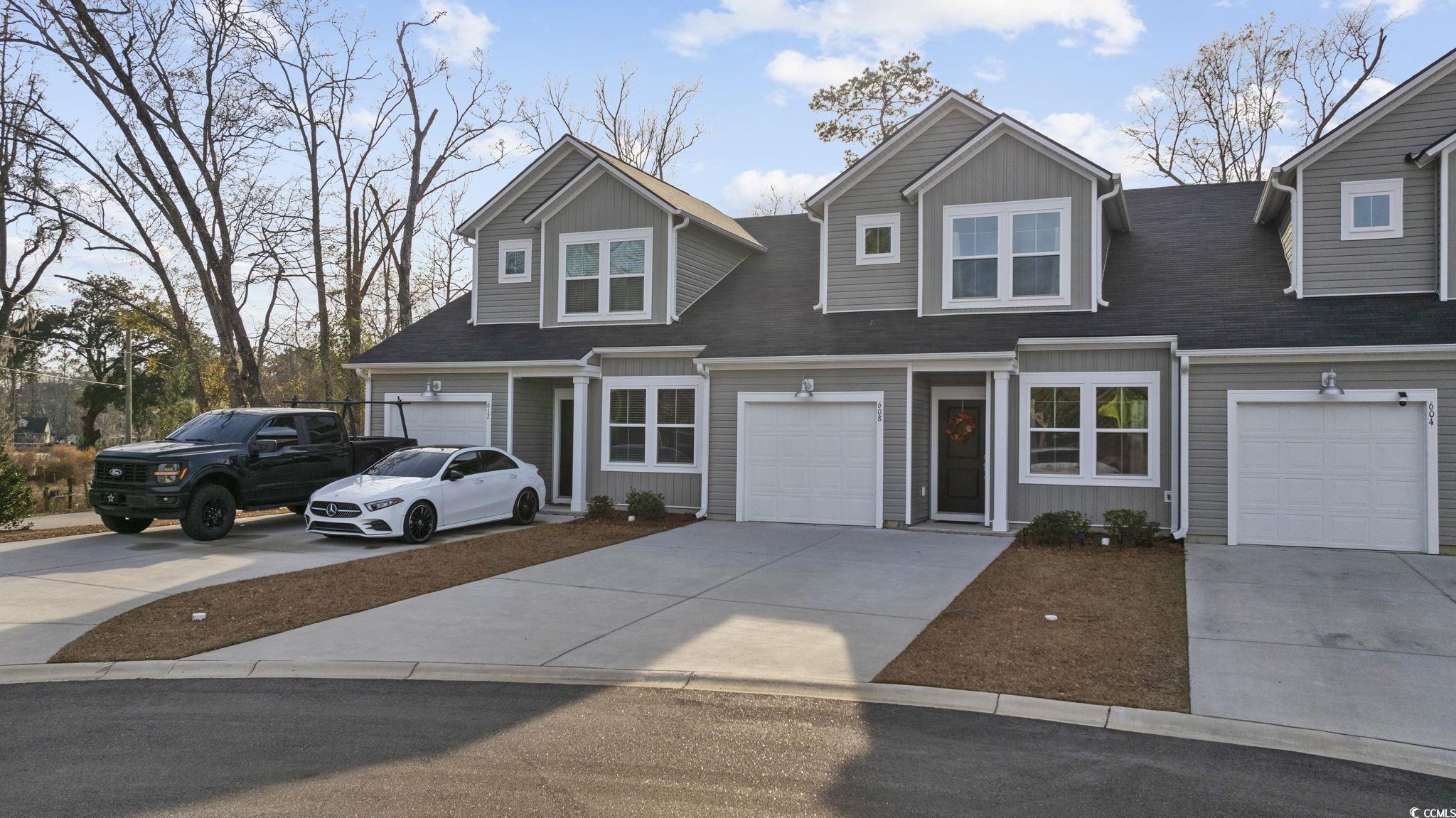 608 Sea Sparrow Street, Unit 608 Myrtle Beach, SC 29588 - Photo 35 of 37 View of front of home with concrete driveway