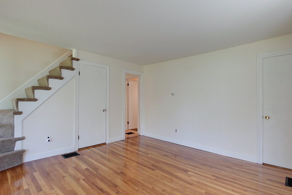 92 Squannacook Road Shirley, MA 01464 - Photo 10 of 38 a view of a room with wooden floor and white walls