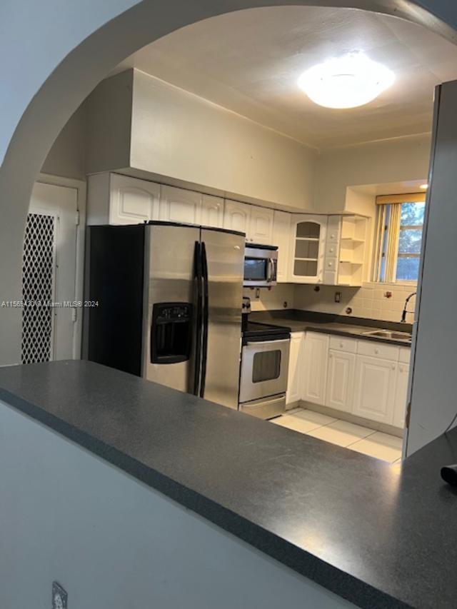 19260 Franjo Road Cutler Bay, FL 33157 - Photo 12 of 18 a kitchen with stainless steel appliances a refrigerator and a stove
