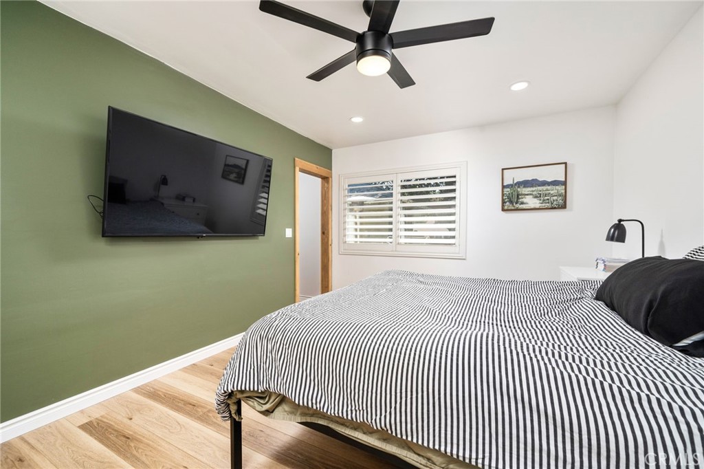 1995 Rincon Avenue Riverside, CA 92506 - Photo 14 of 18 a bedroom with a bed and a flat screen tv