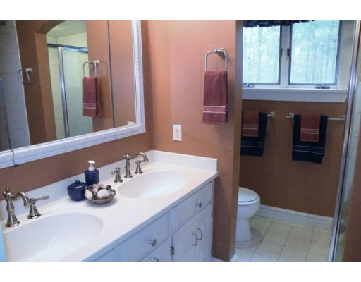 20 Rowley Road Boxford, MA 01921 - Photo 12 of 21 a bathroom with a sink a toilet and mirror