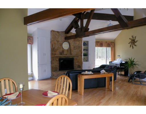 20 Rowley Road Boxford, MA 01921 - Photo 6 of 21 a living room with furniture a fireplace and a flat screen tv