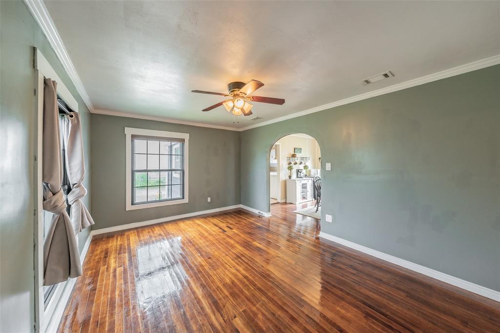 1802 Keneipp Road Carrollton, TX 75006 - Photo 4 of 22 This room features hardwood floors, a window, and a ceiling fan with lighting