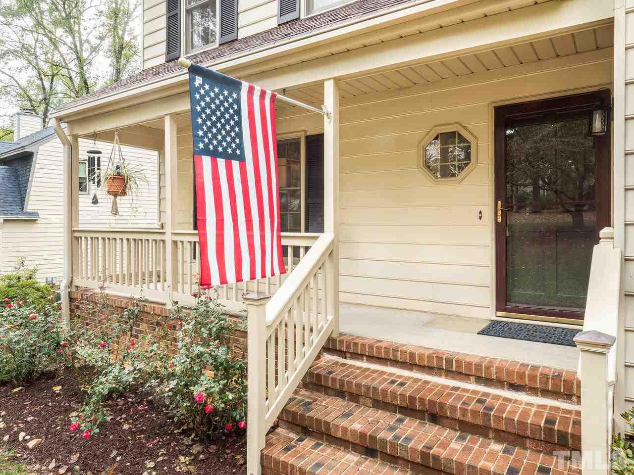 7705 Valley Run Drive Raleigh, NC 27615 - Photo 2 of 27 a front view of a house with a yard