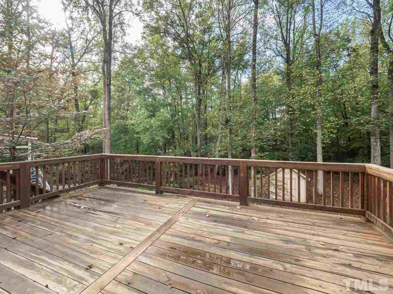 7705 Valley Run Drive Raleigh, NC 27615 - Photo 12 of 27 a view of balcony with wooden floor and fence